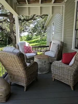 Guests relaxing on the front porch at Round Top Inn